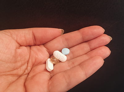 hand-holding-pills-tablets-thumb